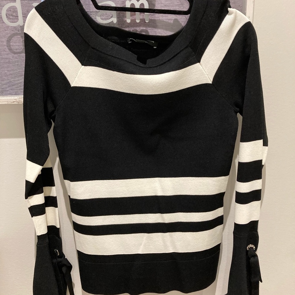 Black and white sweater. Never worn. Tags on.